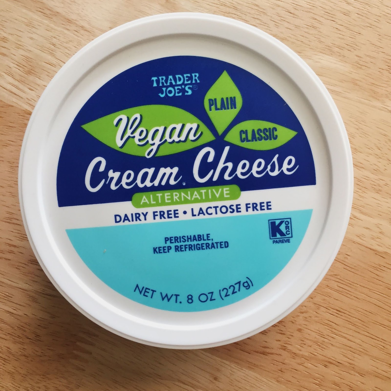 Dark blue, light blue and green packaging for Trader Joe's Vegan Cream Cheese Alternative Plain and Classic.