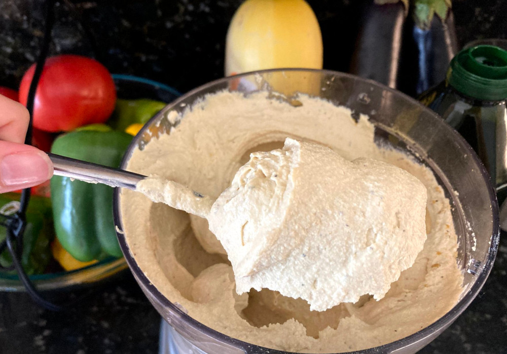 A spoonful of creamy vegan ricotta right out of the food processor.