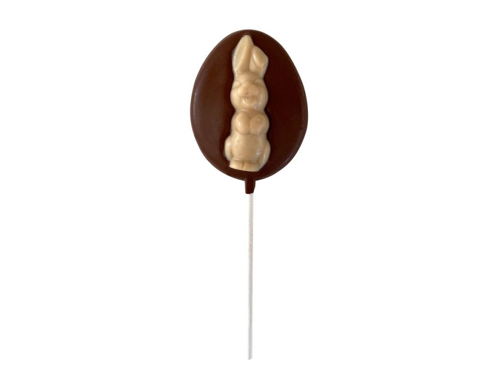 Sjaak's vegan white and milk chocolate lollipop shaped like an egg with bunny in the middle.
