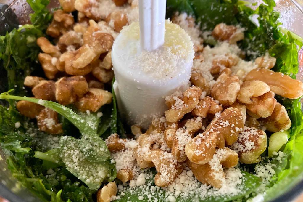 Vegan pesto with walnuts and vegan parmesan in the food processor.