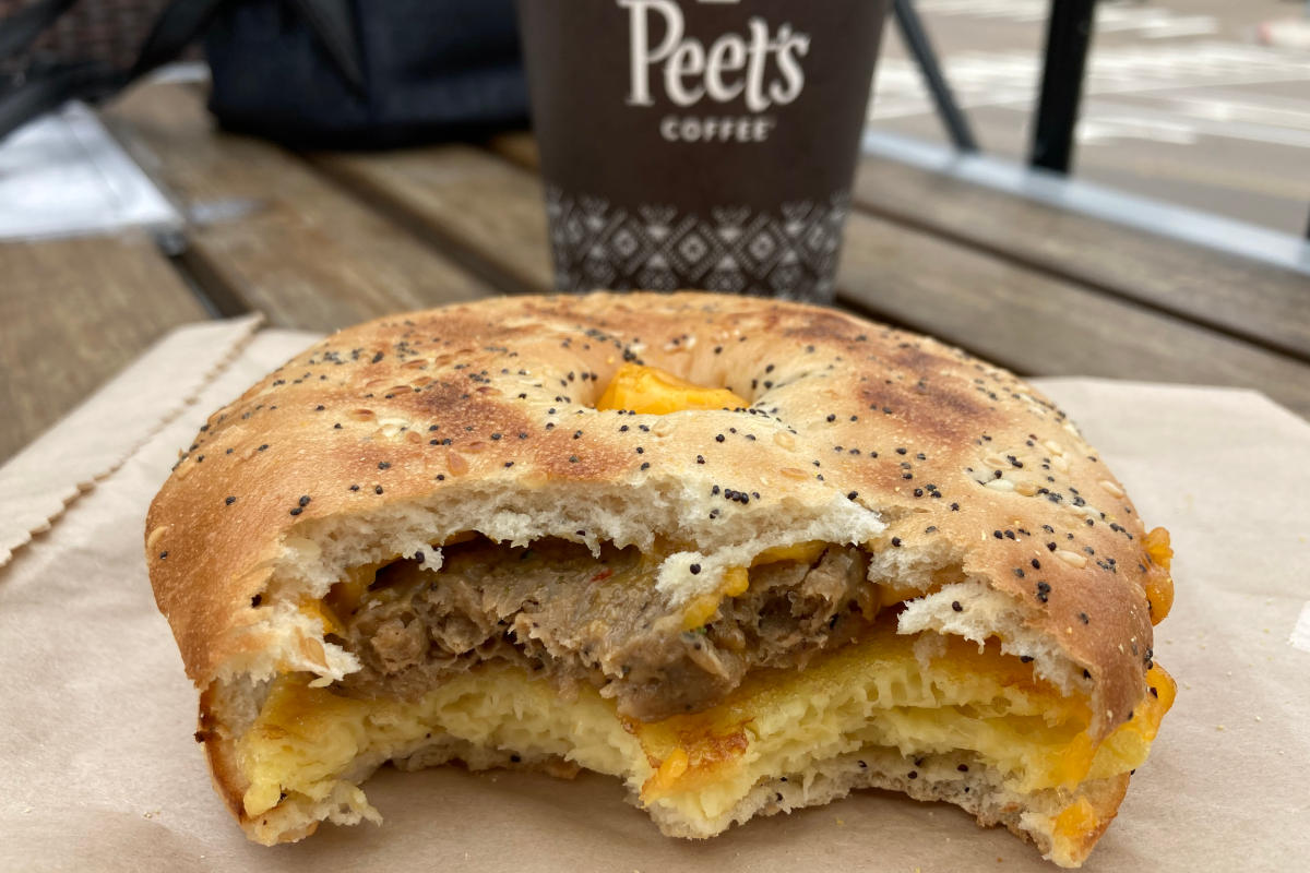 Peet's vegan breakfast sandwich after two bites with vegan cheese, beyond sausage, and just egg.