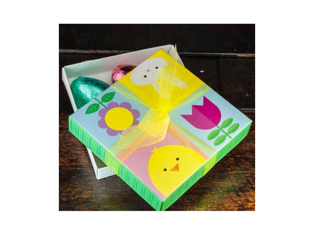 Easter-themed box of vegan mini chocolate eggs wrapped in different colors.